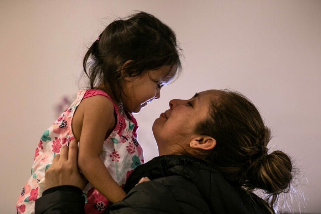 Mother and young daughter who were cruelly separated at the U.S.-Mexico border embrace as they are finally reunited.