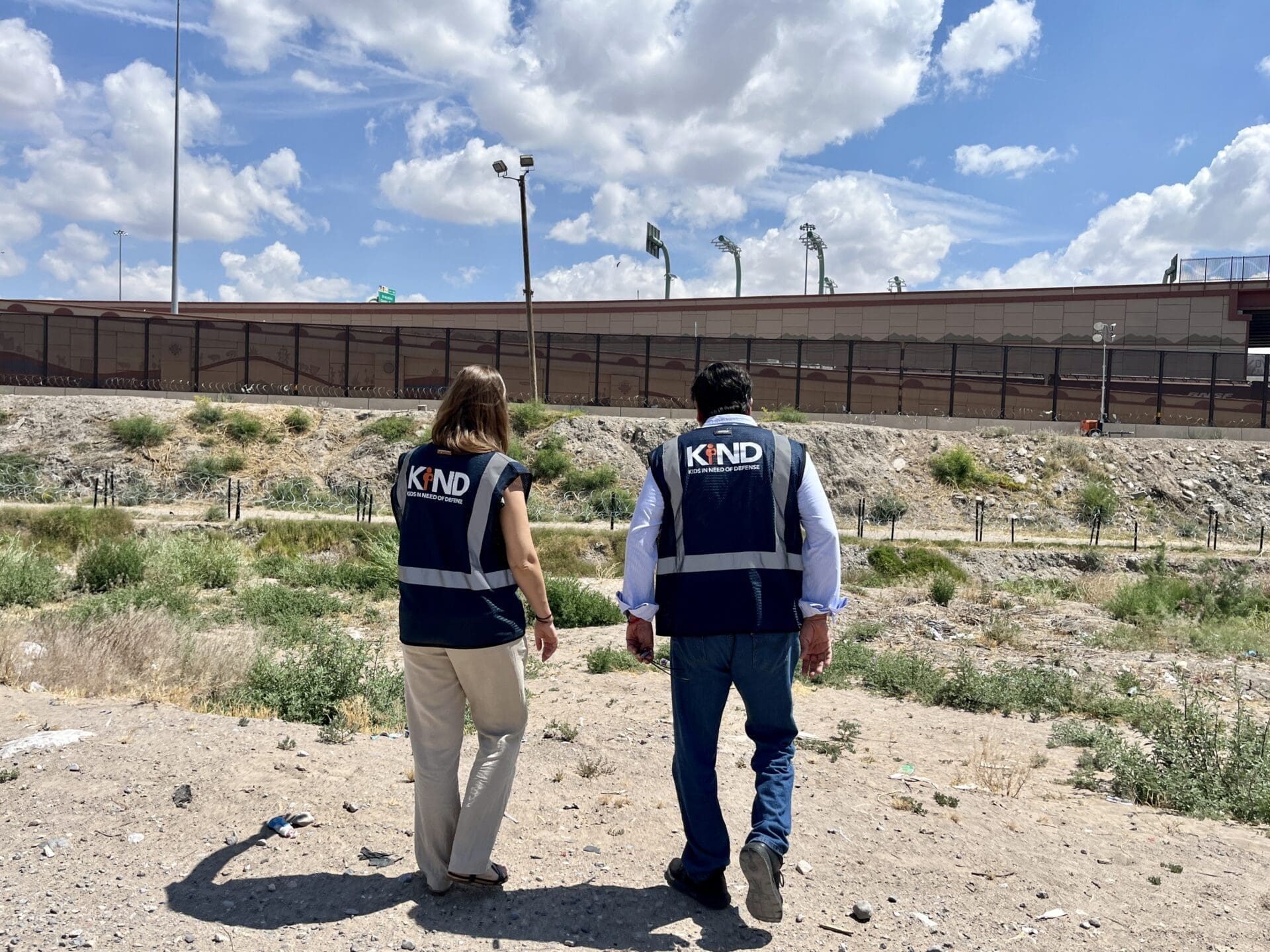 KIND staff overlooking the U.S.-Mexico border.