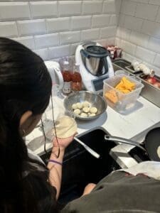 image of child making food in a kitchen