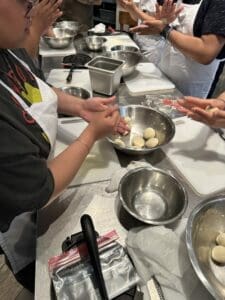 image of child's hands making food in a kitchen