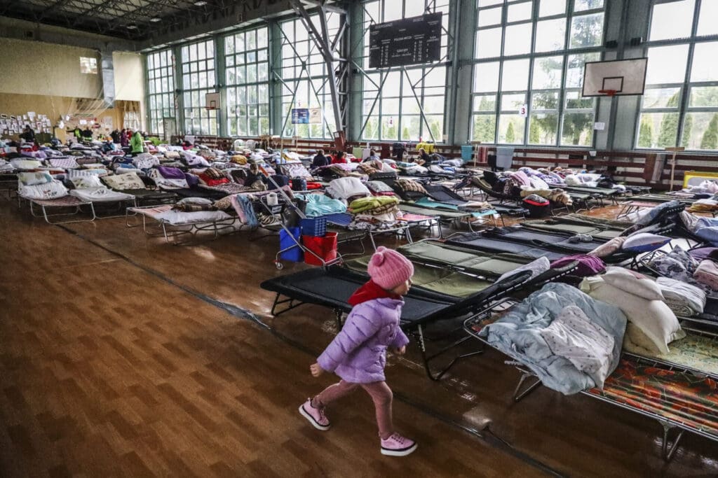 Refugees from Ukraine who crossed Ukrainian-Polish border due to ongoing Russian military invasion are seen at a temporary shelter inside the reception point organized in a sports hall in Hrubieszow, Poland on April 1st 2022. Russian invasion on Ukraine causes a mass exodus of refugees to Poland.